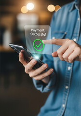 Photo of person using mobile phone with payment successful notification for online transaction and digital banking