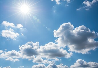 The bright sun shines through the clouds on a beautiful blue sky day.