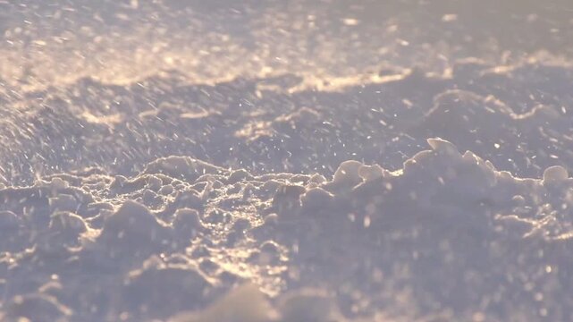 Close up of snow crystals sparkling in the sunlight on a cold winter day