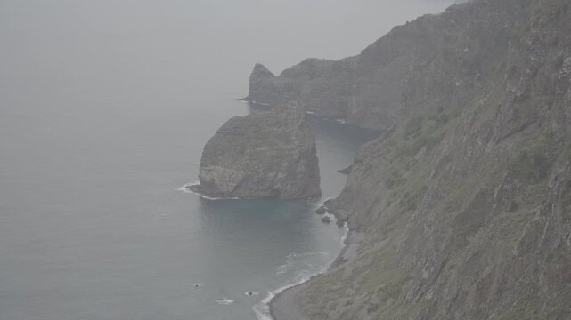Dramatic coastal cliffs and sea stacks along madeira island portugal captured in wide shot overlooking atlantic ocean and rugged shoreline (SLOG3)