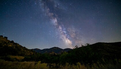 Milky way over hills night sky