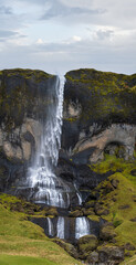 Waterfall view during auto trip in Iceland. Spectacular Icelandic landscape with  scenic nature.