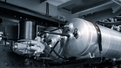 Bundle of pipes connected to industrial hydraulic pneumatic machine, industrial concept background