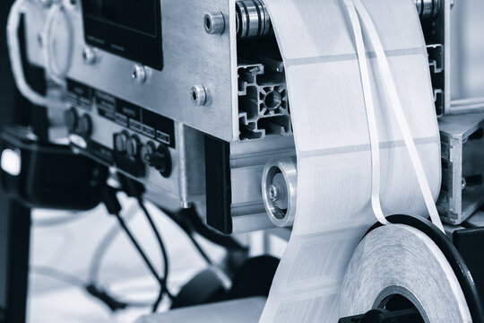 Fragment of the conveyor of sticking labeling machine. Abstract industrial background.