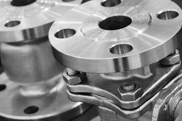 Steel water pipe with a plate on top for bolting. The plate is made of metal and has a hole in the middle. Engineering fittings Industrial concept