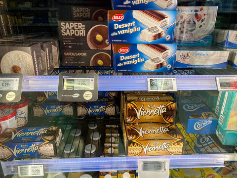 Conselve, Italy - May 16, 2025: Ice cream and dessert products displayed in a supermarket freezer, featuring various brands like Selex and Viennetta, showcasing a tempting selection of frozen treats