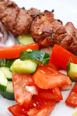 Close view of cucumber and tomato salad