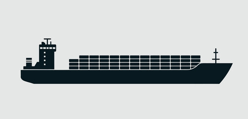 Silhouette of a cargo ship loaded with containers