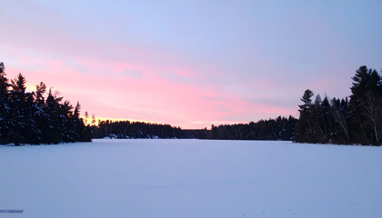 Winter sunrise over frozen lake