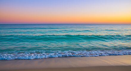 Fototapeta premium Serene beach scene featuring gentle waves under a vibrant sunset sky colors