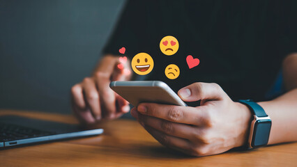 Stay Connected Man Using Social Media on Phone Spreading Love and Happiness with Emoticons, Perfect for Social Media Marketing Campaigns and Digital Engagement