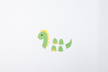 green paper cutouts for craft workshops, seasonal decoration kits, kids creative learning tools, step in creative project, top view,