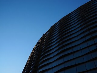 Modern architectural building facade exterior design against clear blue sky view day