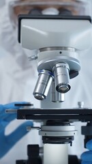 Medical virologist in a hazmat suit, mask, and gloves, diligently working at a microscope in a laboratory researching viruses. Healthcare and science concept