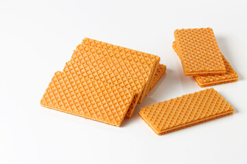 Vanilla Sugar Wafers in a pile on white background