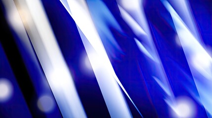 Abstract vibrant lines of blue and white light streaks against a dark background