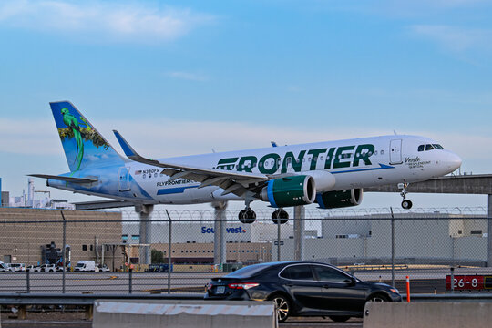 Sky Harbor Airport 7-26-2025 Phoenix AZ USAFrontier Airlines Airbus A320Neo N380FR sunset arrival into runway 26 at Phoenix Sky Harbor Intl. Airport.