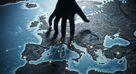 Dark silhouette hand reaching toward European continent map suggesting political manipulation or corporate control over regional territories and governance