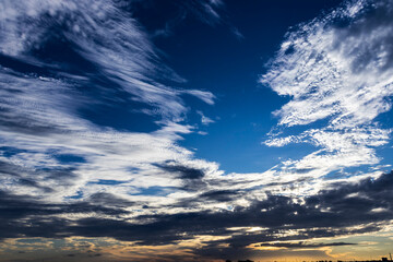 Dramatic sunset in the Sky through cumulus storm clouds,. Awesome epic landscape. Amazing vibrant colors, in Brazil