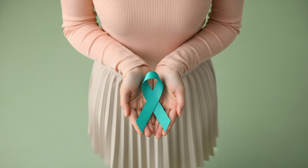 Ovarian and Cervical Cancer Awareness. Woman Holding Teal Ribbon on Lower Abdomen, Uterus, Female Reproductive System, Women's Health, PCOS and Gynecology
