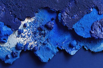 Abstract texture of layered, fragmented blue paint