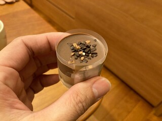 Hand holding a bite-sized cupcake