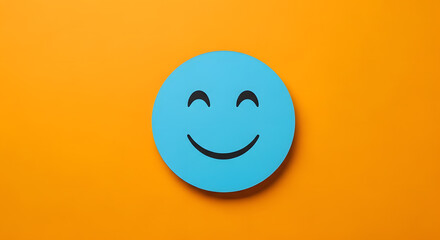 Fototapeta premium Blue round circle with a happy or smiley face icon on it against yellow background.