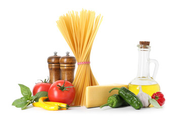 Raw spaghetti pasta and different ingredients isolated on white