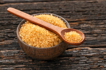 Organic brown cane sugar in spoon - Saccharum officinarum