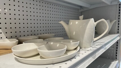 White Teapot and Serving Dishes on Shelf for Kitchen Decor and Tableware Display Design