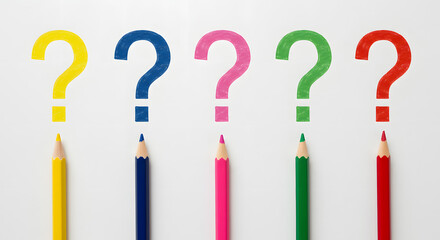 Colored pencils and Question mark , Question mark laid out with sharpened multi-colored pencils
