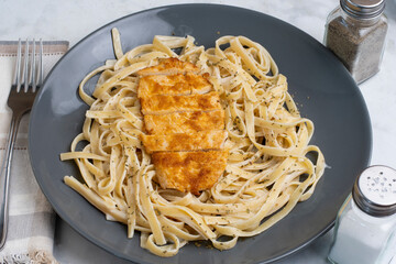 fettuccine alfredo with seasoned chicken breast