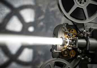 Obraz premium Close-up of a film projector projecting a beam of light, with film reels and intricate gears in focus against a textured background.
