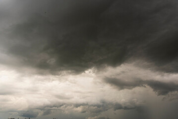 Dramatic dark storm thundercloud rain clouds on black sky background. Dark thunderstorm clouds rainny landscape. Meteorology danger windstorm disaster climate. Dark cloudscape storm disaster gray sky