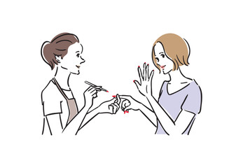 ネイルサロンで楽しそうに施術を受ける女性