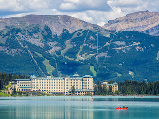 Fairmont Chateau Lake Louise hotel with mountains in the background
