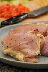 Raw Chicken Thighs on Plate Ready for Cooking