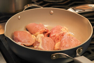 Chicken Thighs Searing in Frying Pan