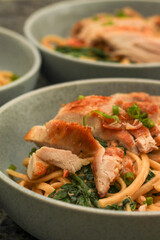 Closeup of Bowl of Creamy Tuscan Linguine Pasta with Chicken Thighs