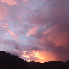 Fiery Sunset Over Mountain Silhouette