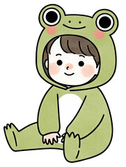Fototapeta premium A child in a green frog costume, smiling and sitting comfortably, embodying playful innocence and charm.