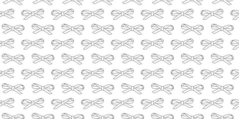Fototapeta premium Bows on white background. Seamless pattern with outline bows. Black and white little bows pattern