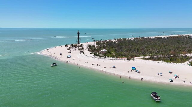 Still shot of Sanibel Island Lighthouse Beach Park with boats in the background off the coast of Fort Myers in Lee County, southwest Florida
