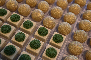 gourmet white chocolate party sweets, elegant floral dessert decoration, square sweet treats for events, beautiful handmade candy with flower

