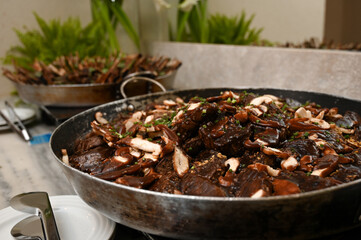 mushroom and meat dish, buffet food catering, large pan with gourmet meal, delicious beef and mushrooms