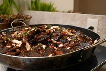 mushroom and meat dish, buffet food catering, large pan with gourmet meal, delicious beef and mushrooms