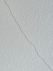 white wall, paper, cardboard with small line cracks