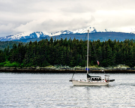 sailing on the lake in Alaska with mountains