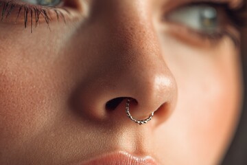 Obraz premium Zoomed in view of a woman s nose with a piercing