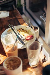Empty Breakfast Plate and Drinks on Café Table